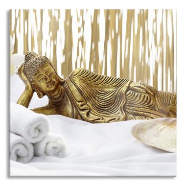 Glasbild Goldener Buddha auf Handtuch