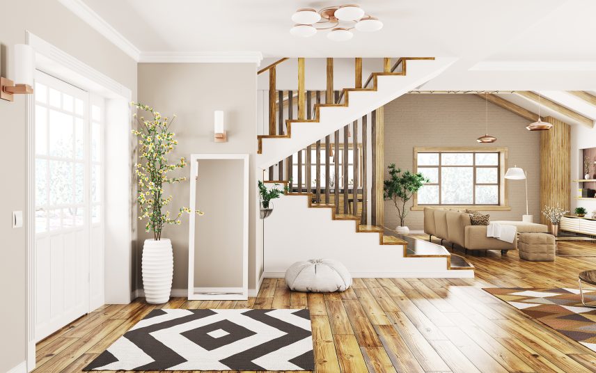 Offenes modernes Wohnen im Amerikanischen Stil – offener Flurbereich mit Treppenaufgang übergehend zum Wohnzimmer mit Küche – Polstermöbel im Wohnbereich