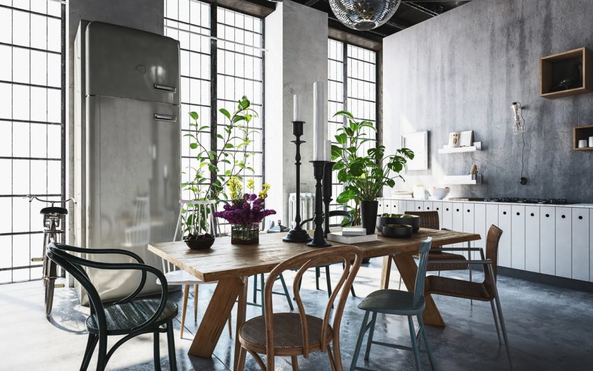 Industrielle Küche mit dekoriertem Tisch als Wohnidee – Beispiel mit Holztisch & Holzstühlen – hohe Kerzenständer in schwarz & verschiedene Vasen
