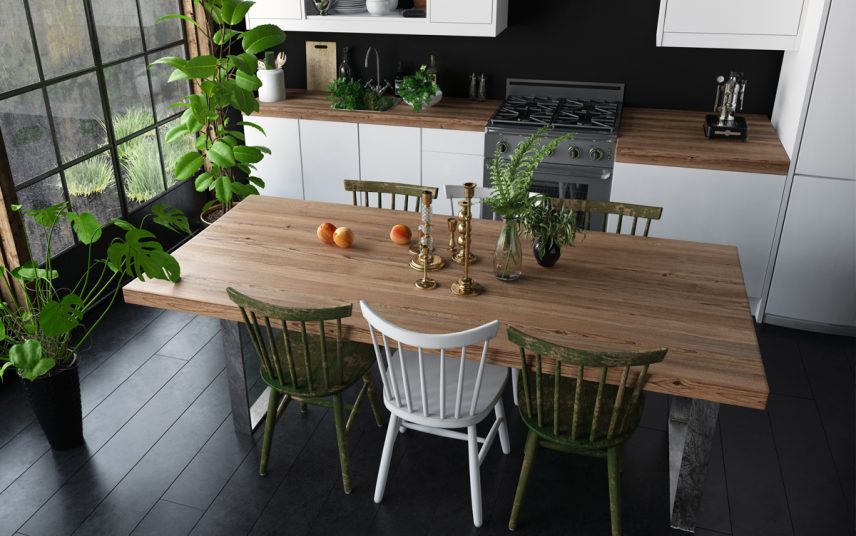 Landhausstil neu interpretiert – Gestaltungsidee für die Küche mit dekoriertem Holztisch & verschiedenen Stühlen – Zimmerpflanzen in Pflanzgefäßen